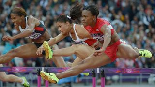  London, United Kingdom; Kellie Wells (USA), right, competes in the women's 100m hurdles semifinals during the 2012