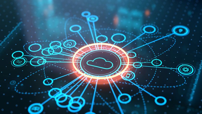 A CGI render of a cloud glowing cloud symbol on a high-tech display, surrounded by nodes which represent the cloud market. Decorative: The cloud is encompassed by a glowing orange circle, while the nodes are blue. All are against a dark, reflective background.