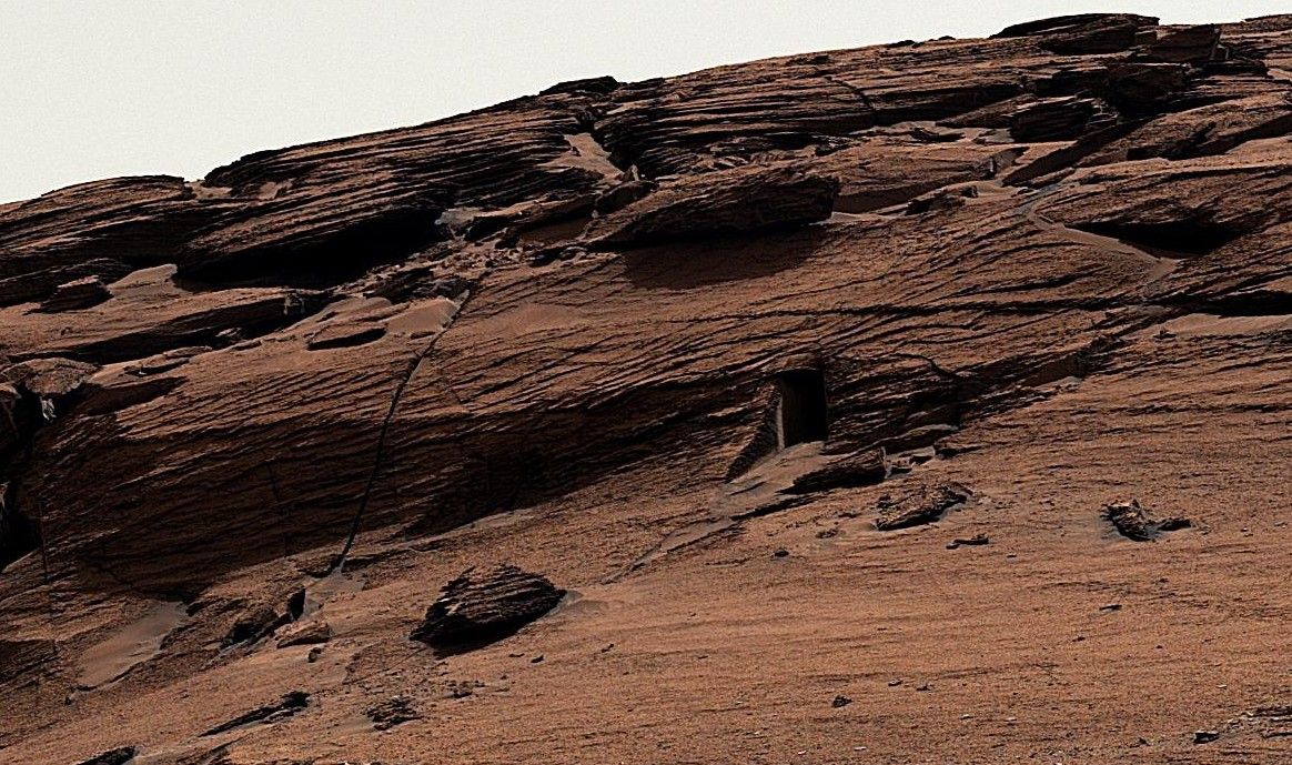 A red rock formation on the surface of Mars.