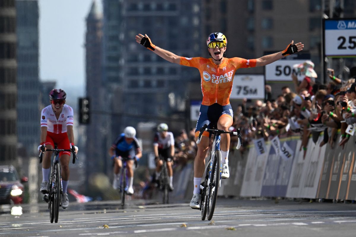 Netherlands's Demi Vollering (R) celebrates at finish line after winning the Women Elite Road Race during the 2026 Union Cycliste Internationale (UCI) Road World Championships in Montreal, Quebec, on September 26, 2026. (Photo by Andrej Ivanov / AFP via Getty Images)