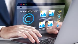 A person types on a laptop with "copyright images" on the screen