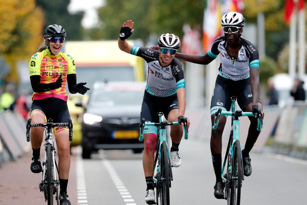 HOOGEVEEN NETHERLANDS OCTOBER 23 Janneke Ensing of Netherlands and Team BikeExchange crosses the finishing line on the last day of her professional career accompanied by her teammate Teniel Campbell of Trinidad and Tobago and Team BikeExchange and Maaike Boogaard of Netherlands and Team Ale Btc Ljubljana after the 17th UCI Womens WorldTour Ronde van Drenthe 2021 a 1591km one day race from Assen to Hoogeveen UCIWWT RondevDrenthe on October 23 2021 in Hoogeveen Netherlands Photo by Bas CzerwinskiGetty Images