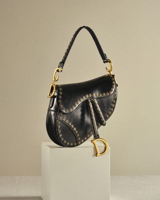 The Dior Saddle bag in black with gold hardware