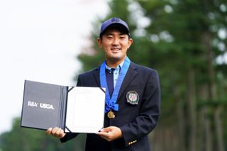 Takumi Kanaya holds up the Mark H. McCormack medal - handed out by the R&A in 2020