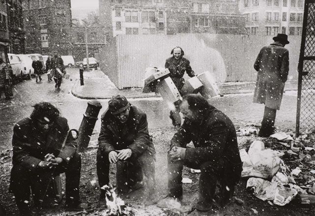 People around a fire, Spitalfields Market, London&#039;