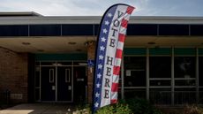 A 'Vote Here' banner is seen outside a polling place in Lansing, Michigan, in 2024.