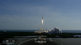 SpaceX's Falcon 9 rocket launching on July 7, 2022, with a first stage flown for a record-breaking 13th time.