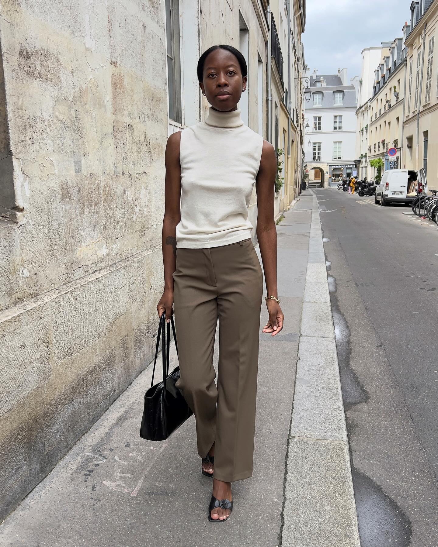'90s-inspired outfit including a turtleneck tank and trousers