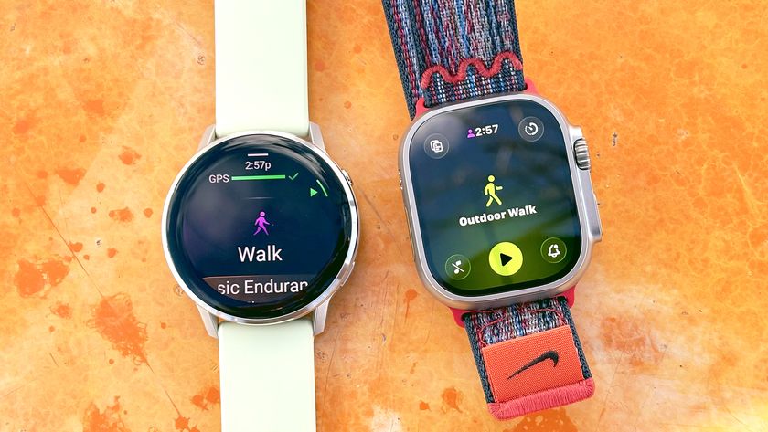 Close-up of the Garmin Venu 4 and Apple Watch Ultra 3 against a weathered orange background