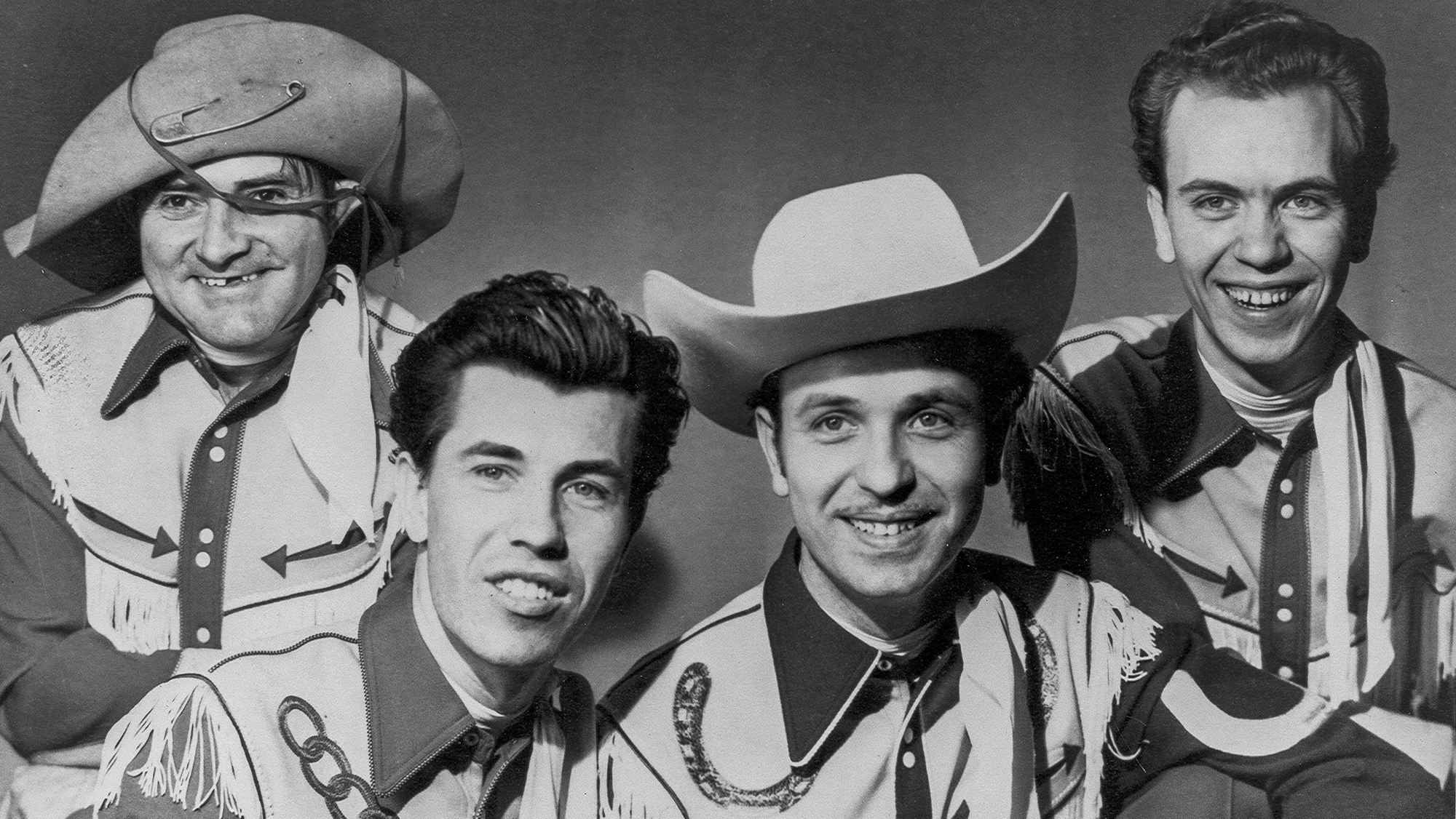 1958: Rock and roll guitarist Link Wray (front left) poses for a portrait with his band, Link Wray and the Wraymen, in 1958.