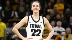 Guard Caitlin Clark #22 of the Iowa Hawkeyes, stands with her hands on her hips as the crowd claps, ahead of the women's March Madness 2024 tournament.