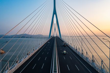 Aerial photography of cross-sea highway at sunset 