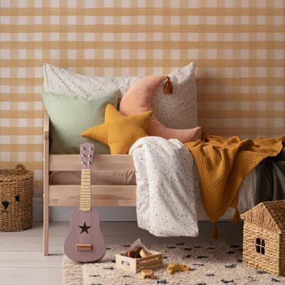 A kids bedroom with gingham wallpaper from Hovia