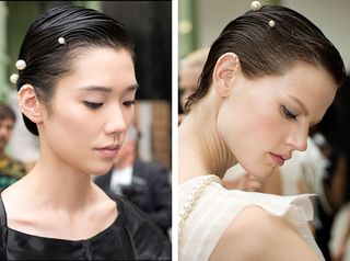 Model hair was wet and combed, then graciously pulled back and decorated with more pearls