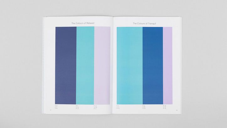 Page spread of soothing dark blues, aquas, and pastel pinks