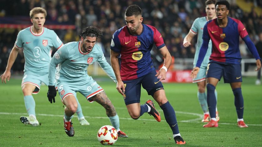 Ferran Torres and Rodrigo de Paul play during the match between FC Barcelona and Atletico Madrid, corresponding to the first leg of the Copa del Rey semi-final, at the Lluis Companys Stadium in Barcelona, Spain, on February 25, 2025. 