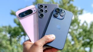 best phones hand holding iphone 15 pro, galaxy S24 Ultra and Pixel 9 Pro XL