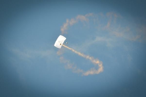 A sky diver made his way down to the race venue