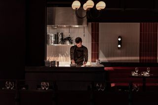 man working in the kitchen behind the counter at stereo covent garden