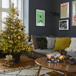 living room with wooden flooring and christmas tree