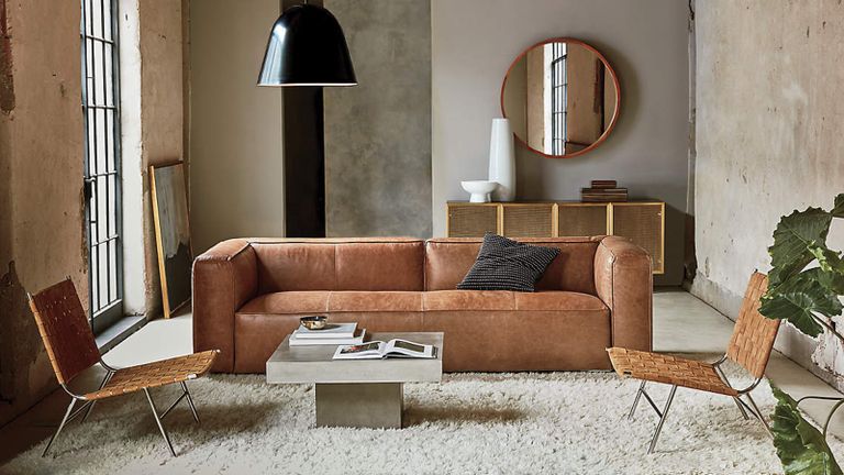 A tan leather sectional sofa in a contemporary living room