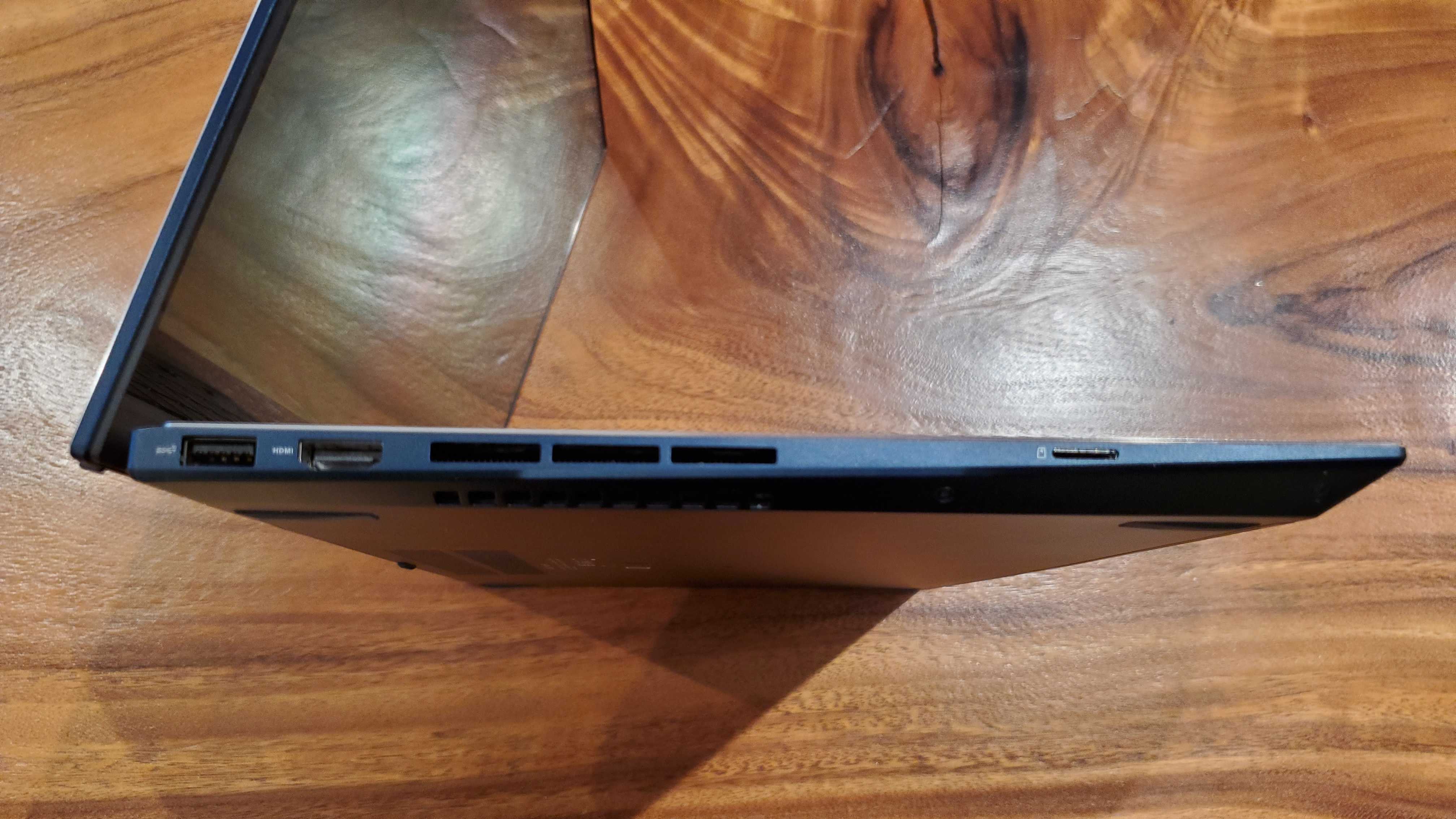 side view of a dark blue laptop