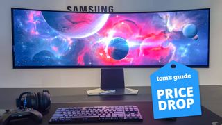 Samsung Odyssey OLED G9 on table with keyboard and controller with Tom's Guide Price Drop badge