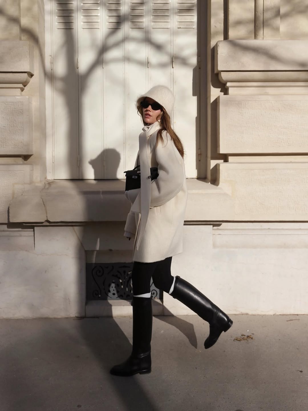 woman wearing leggings with boots outfit 2026