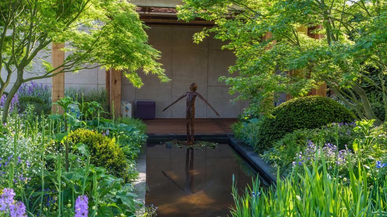 landscaping with shrubs – pond, trees and sculpture