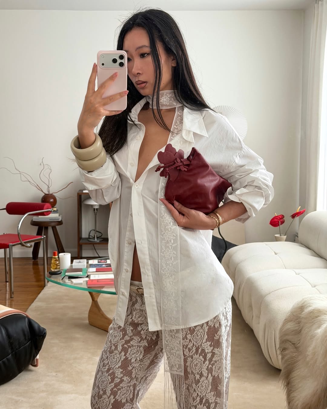 @thecarolinelin wears lace trousers and shirt