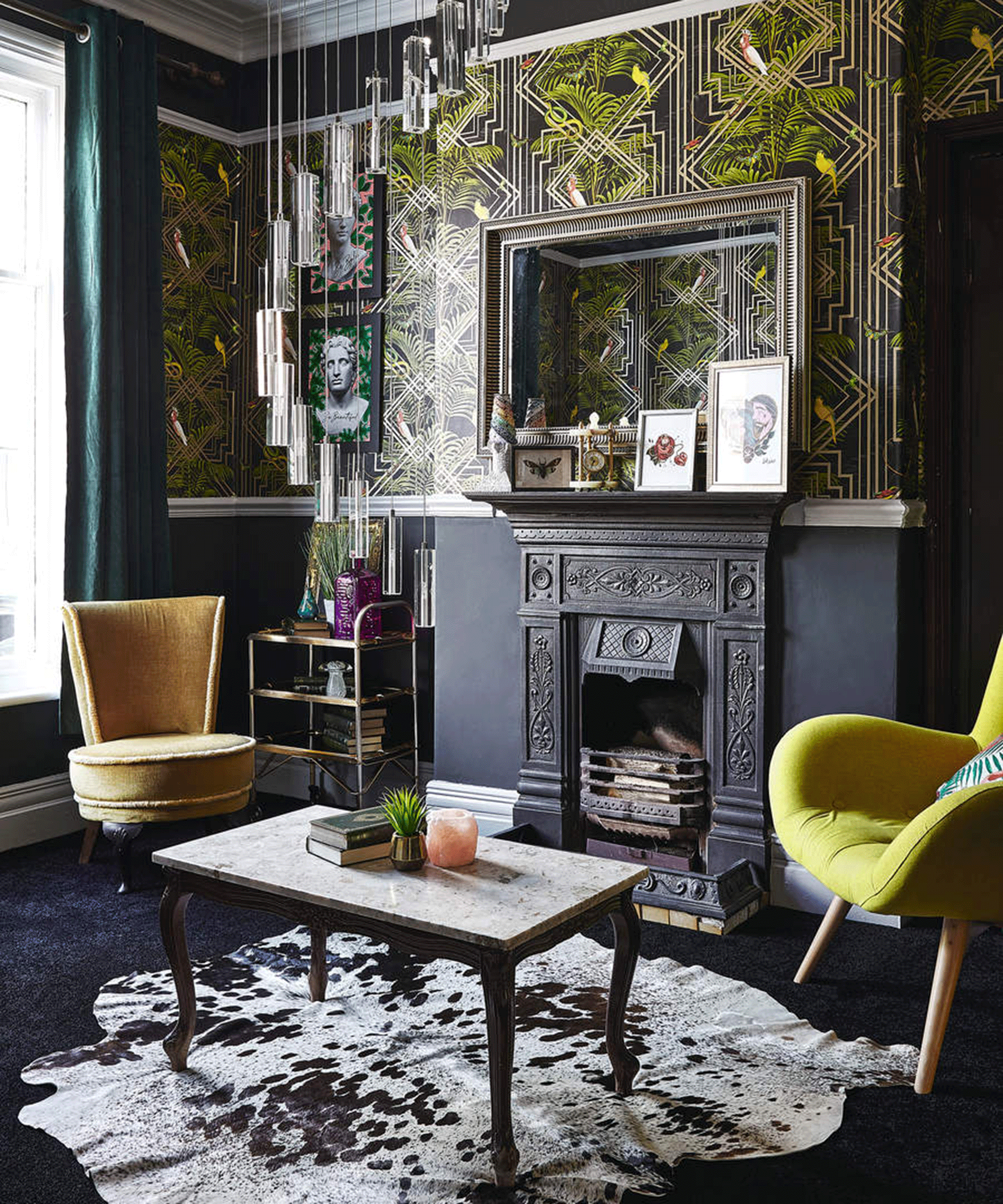 A dark, Art-Deco inspired living room with fireplace and yellow accent chair decor