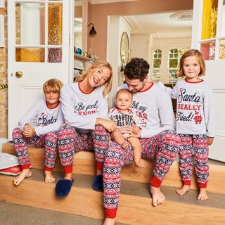 family with matching christmas t-shirt and matching pyjamas