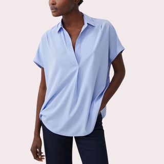 flat lay of woman wearing blue shirt 