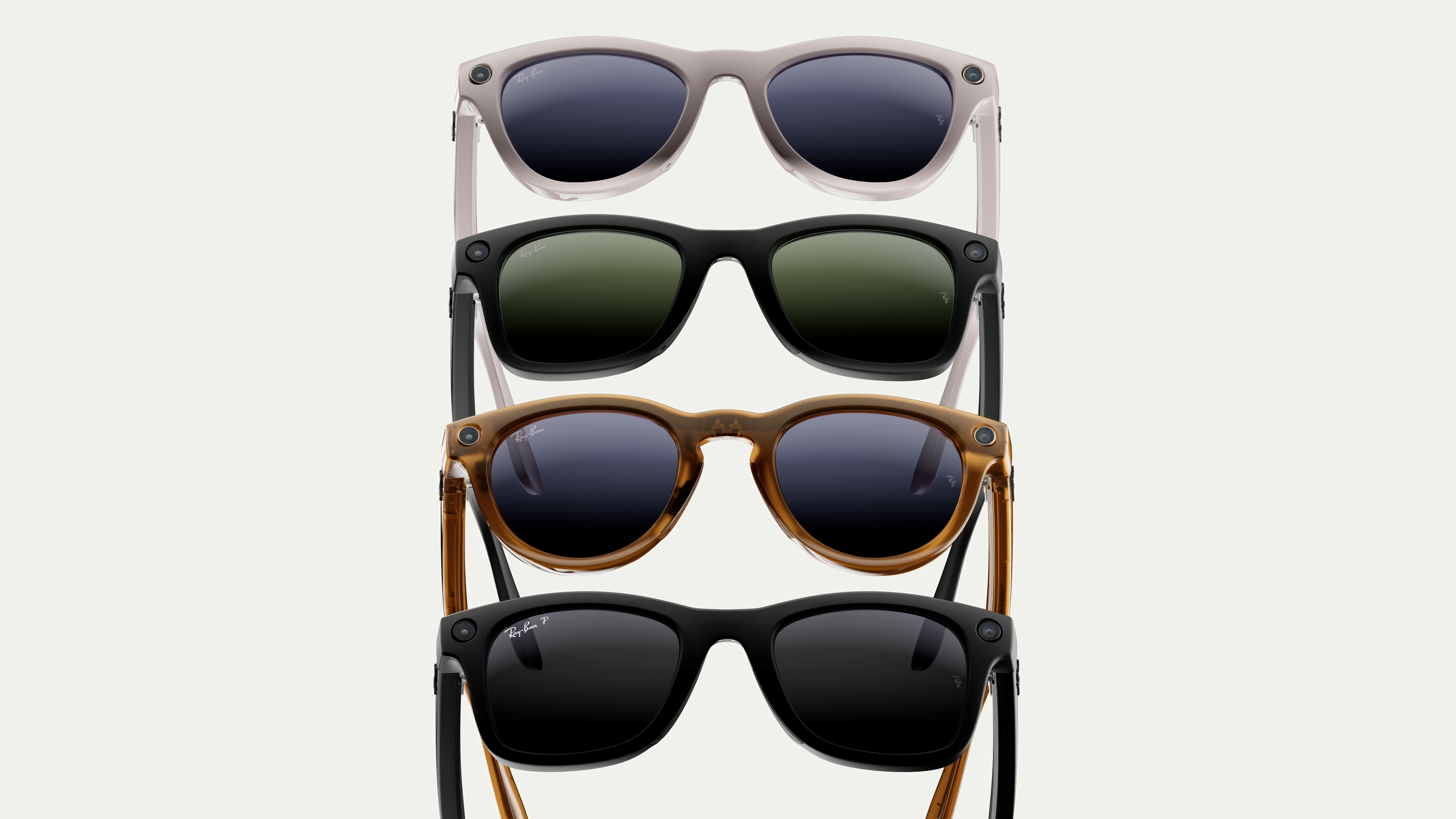 A render of four different styles of Ray-Ban Meta smart glasses stacked atop one another in a white void.