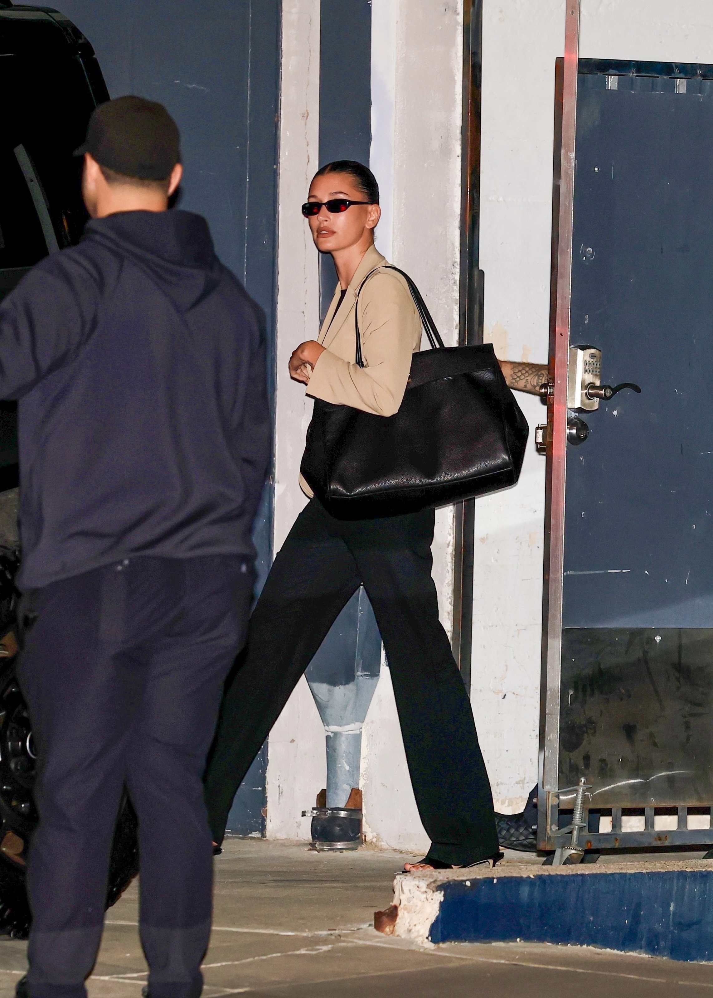 Hailey Bieber traded her flip-flop kitten heels for peep-toe mules inspired by spring's doll heels shoe trend