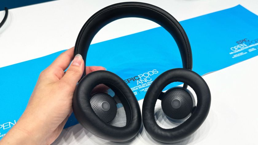 the jlab jbuds open headphones photographed with a white and blue background
