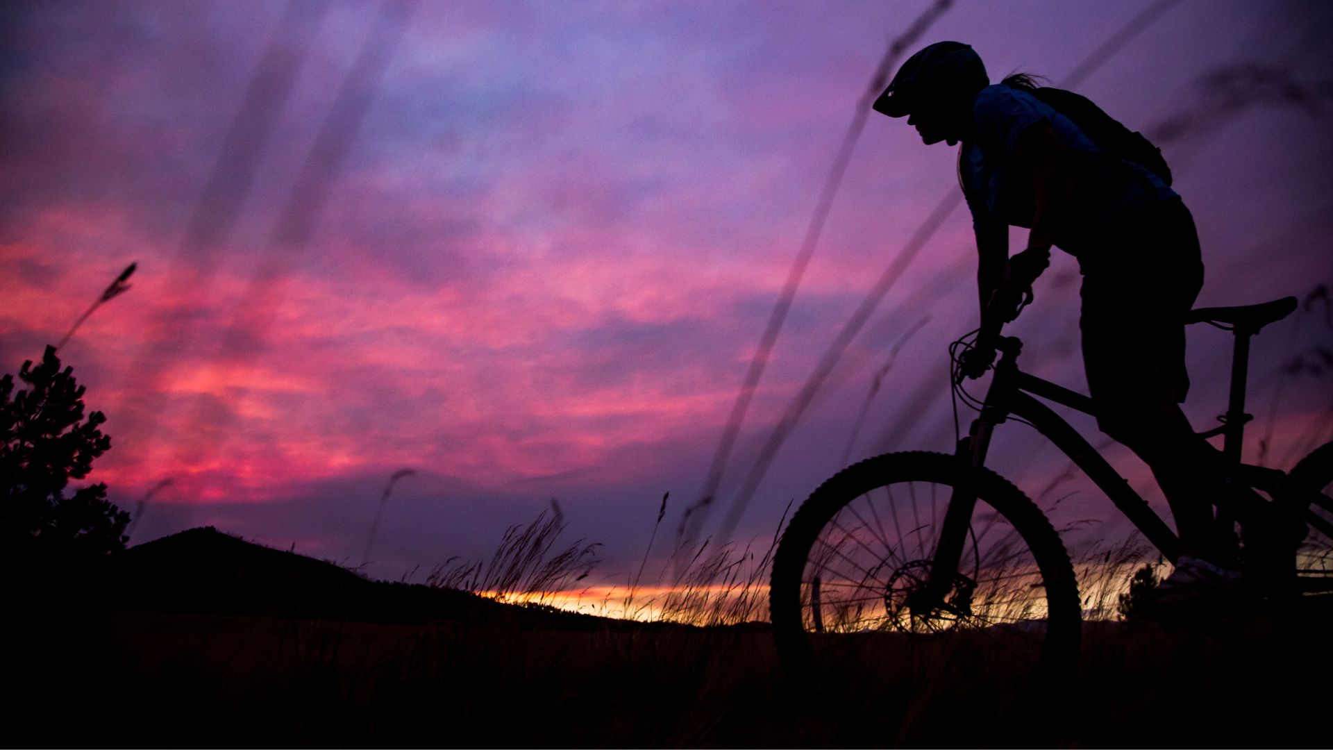 Woman cycling at night