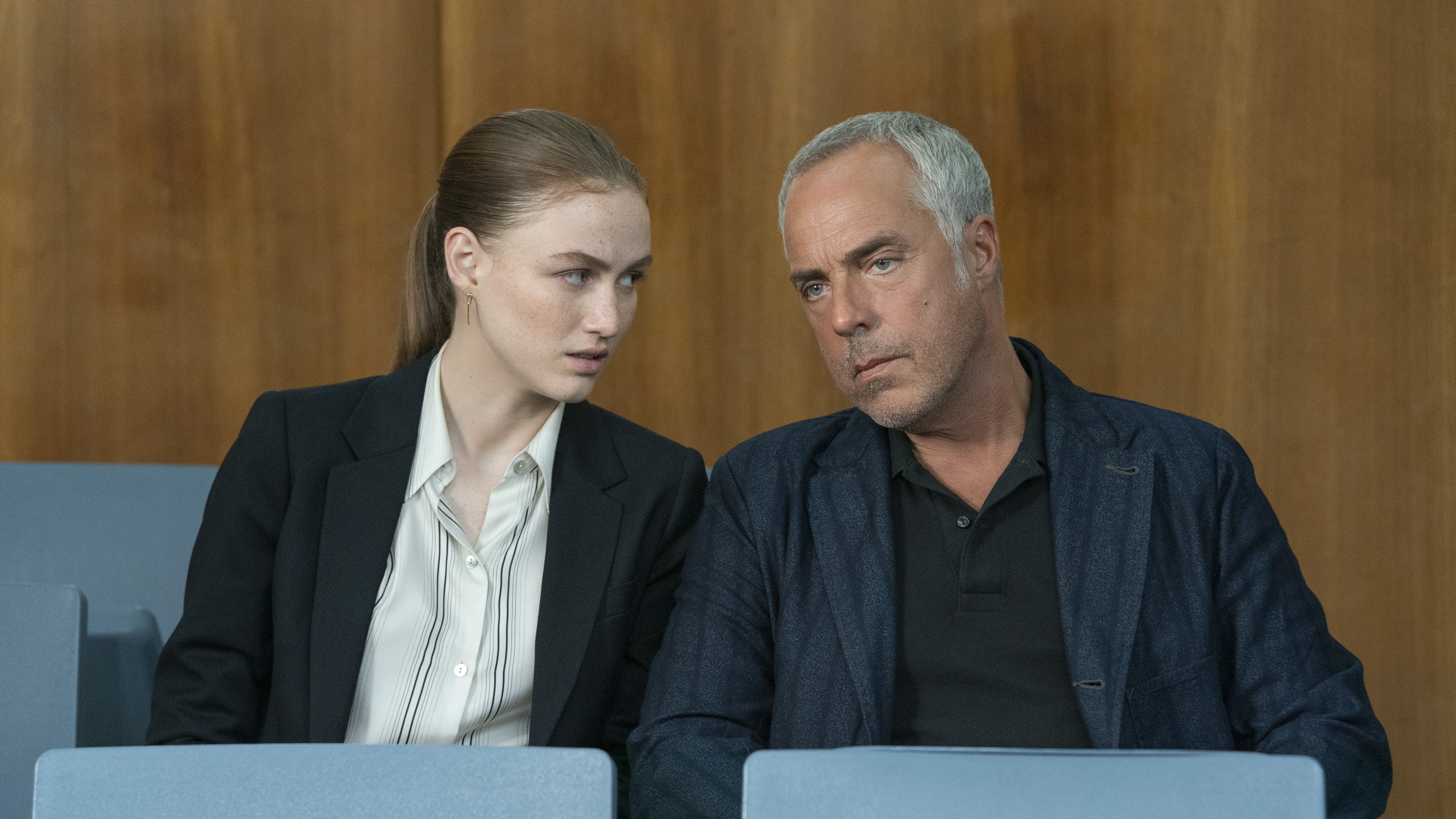 Madison Lintz and Titus Welliver whisper to each other in court in Bosch: Legacy