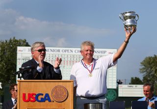 Colin Montgomerie holds the US Senior Open trophy