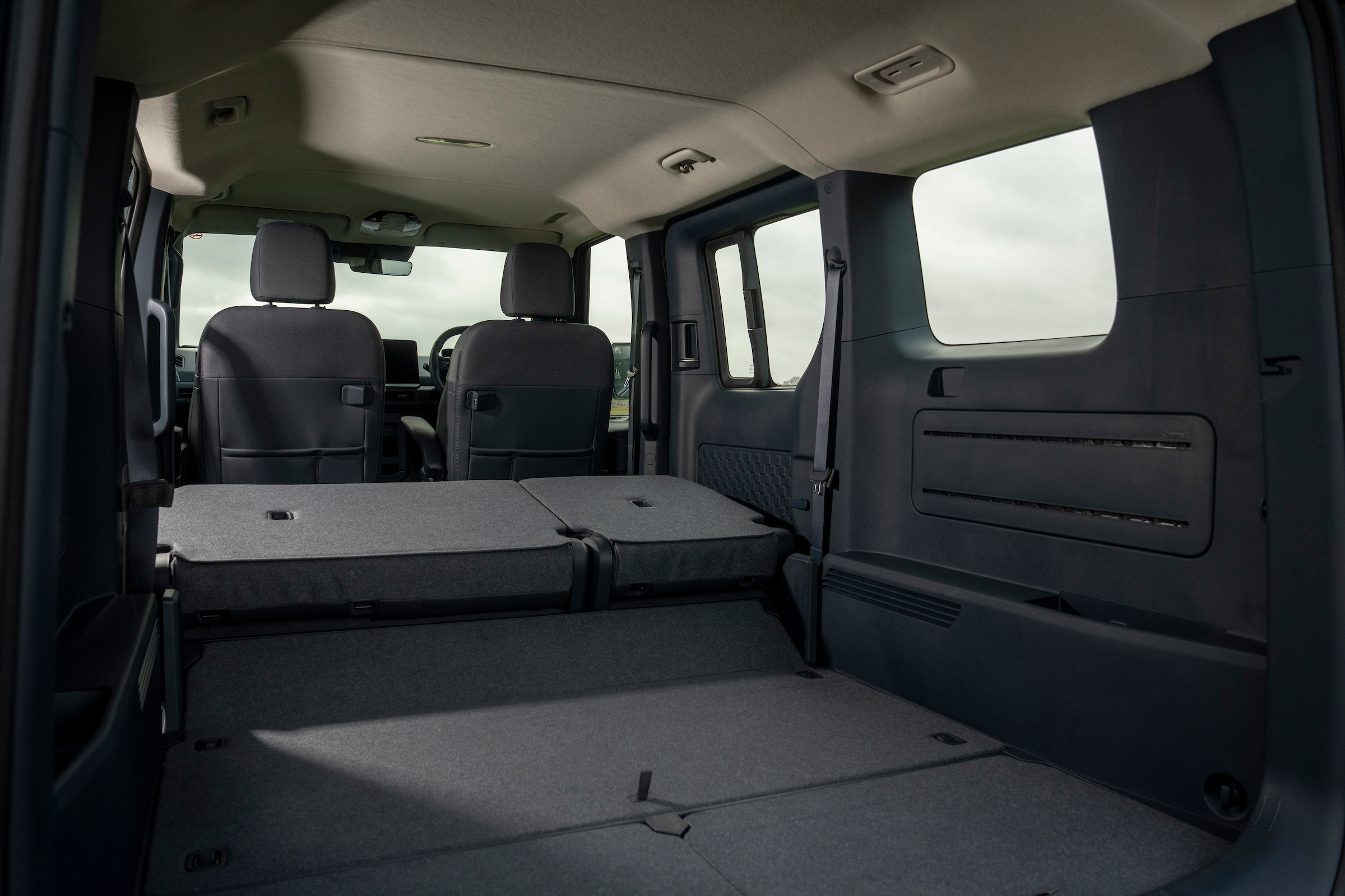 With the seats folded in the Kia PV5