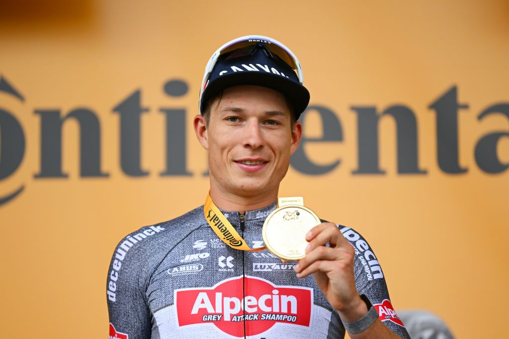 PAU FRANCE JULY 12 Jasper Philipsen of Belgium and Team Alpecin Deceuninck celebrates at podium as stage winner during the 111th Tour de France 2024 Stage 13 a 1653km stage from Agen to Pau UCIWT on July 12 2024 in Pau France Photo by Dario BelingheriGetty Images