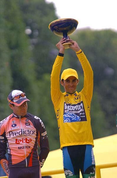 Alberto Contador (Discovery Channel) holds the cup high