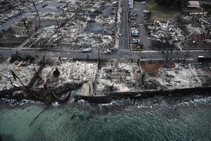 The remnants of burnt homes and streets devastated by fires in Hawaii