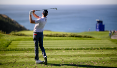 Harris English hits a tee shot into the par 3 at Torrey Pines