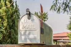 US mailbox from the front with upright flag