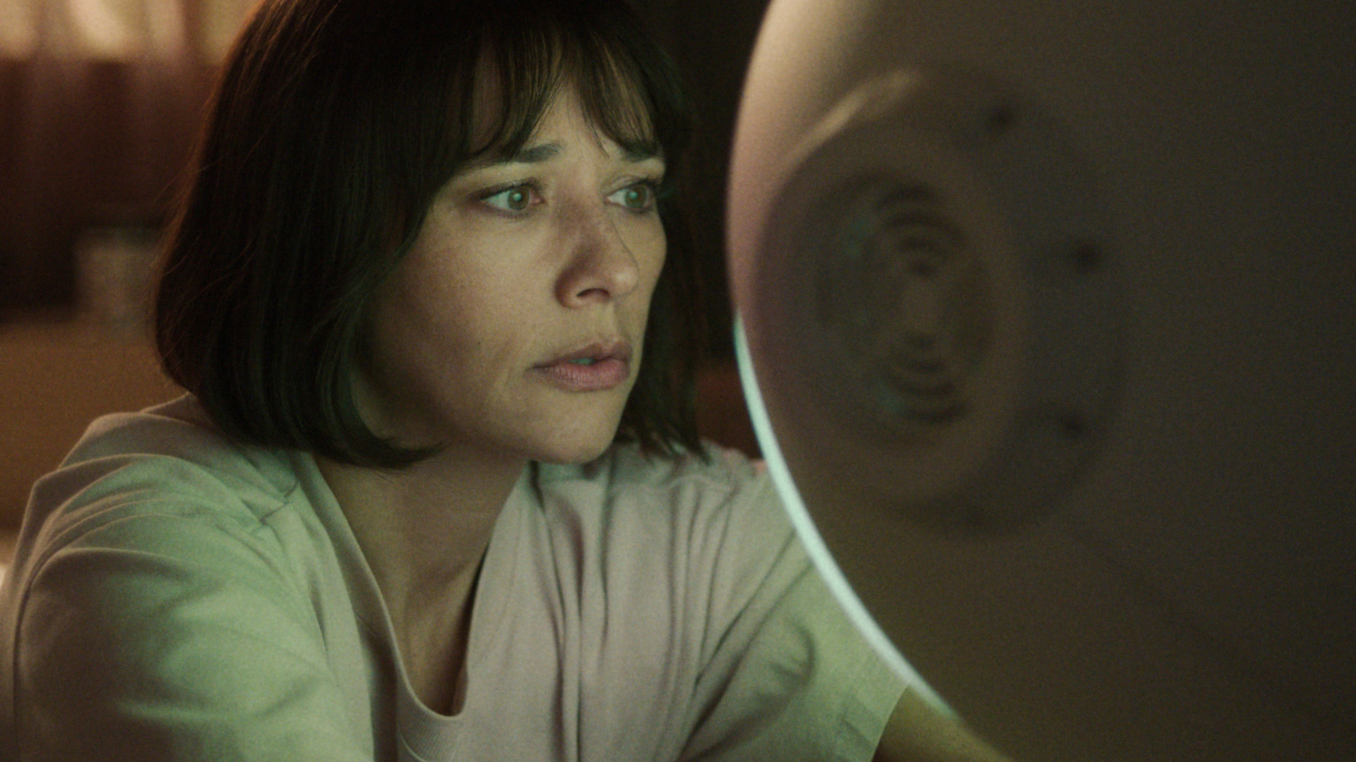 Rashida Jones looks at a robot in Sunny