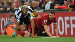 Joelinton of Newcastle United and James Milner of Liverpool during the Premier League match between Liverpool and Newcastle United on 31 August, 2022 at Anfield in Liverpool, United Kingdom