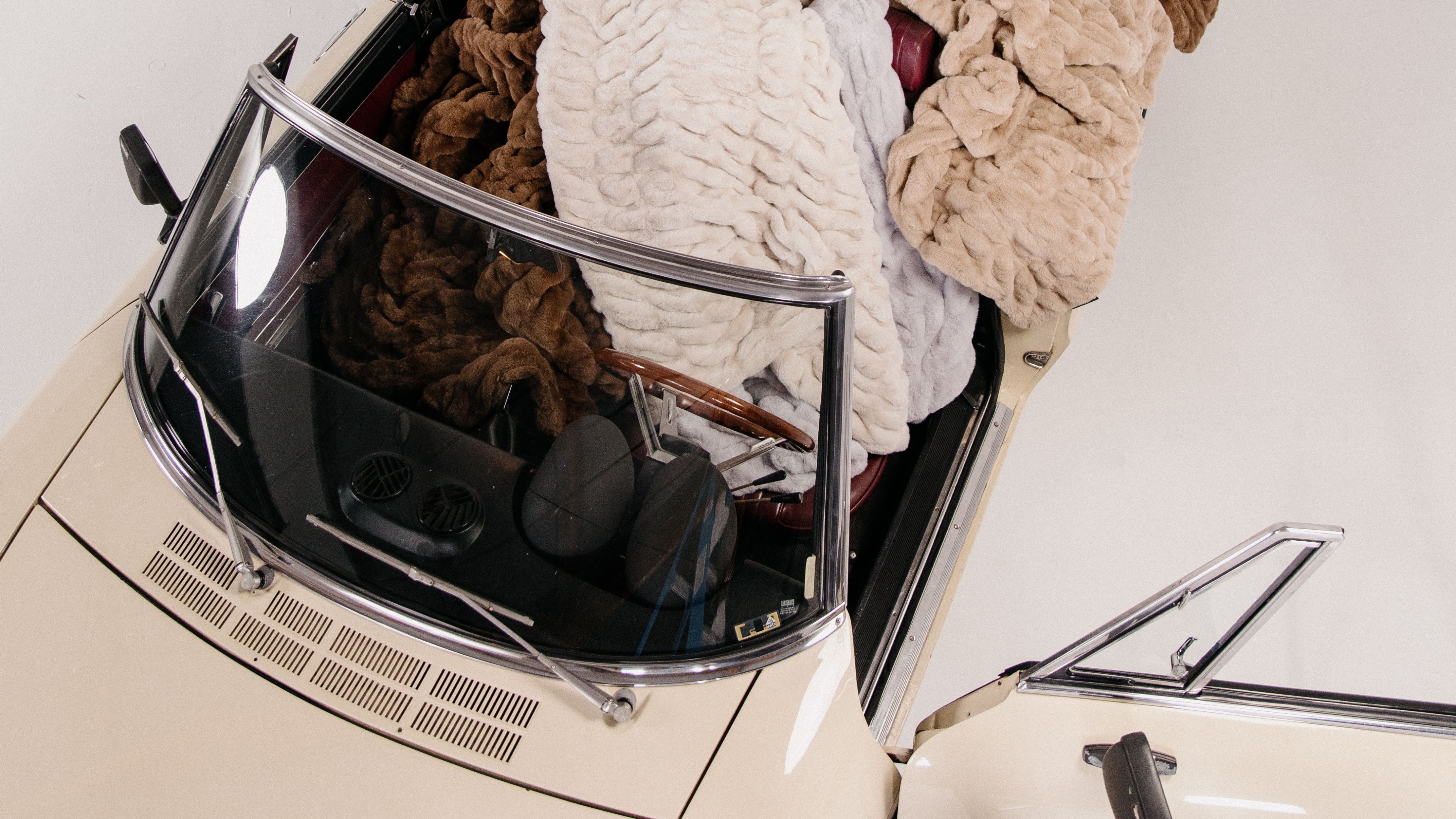 Vintage car stuffed to the brim with faux fur Lola Blankets