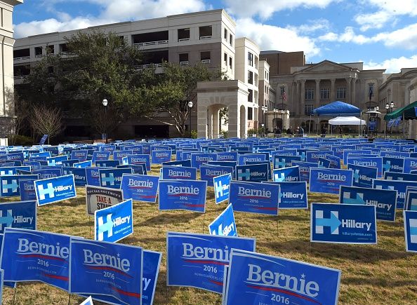 Hillary Clinton and Bernie Sanders signs.