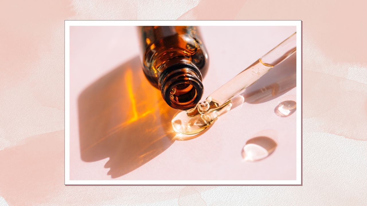 Image of skincare bottle with the contents spilled out, on a pink watercolour background